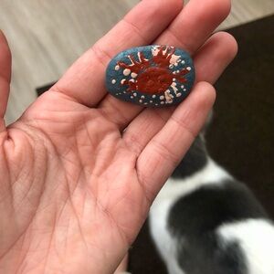 Hand-Painted Pet Rock with Red and Blue Design